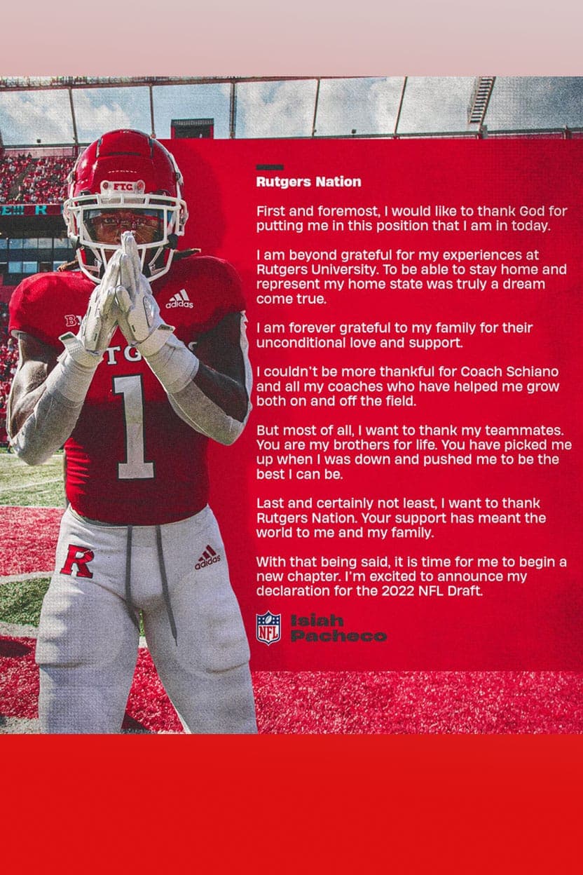 Isiah Pacheco in his Rutgers uniform, making a prayer gesture.